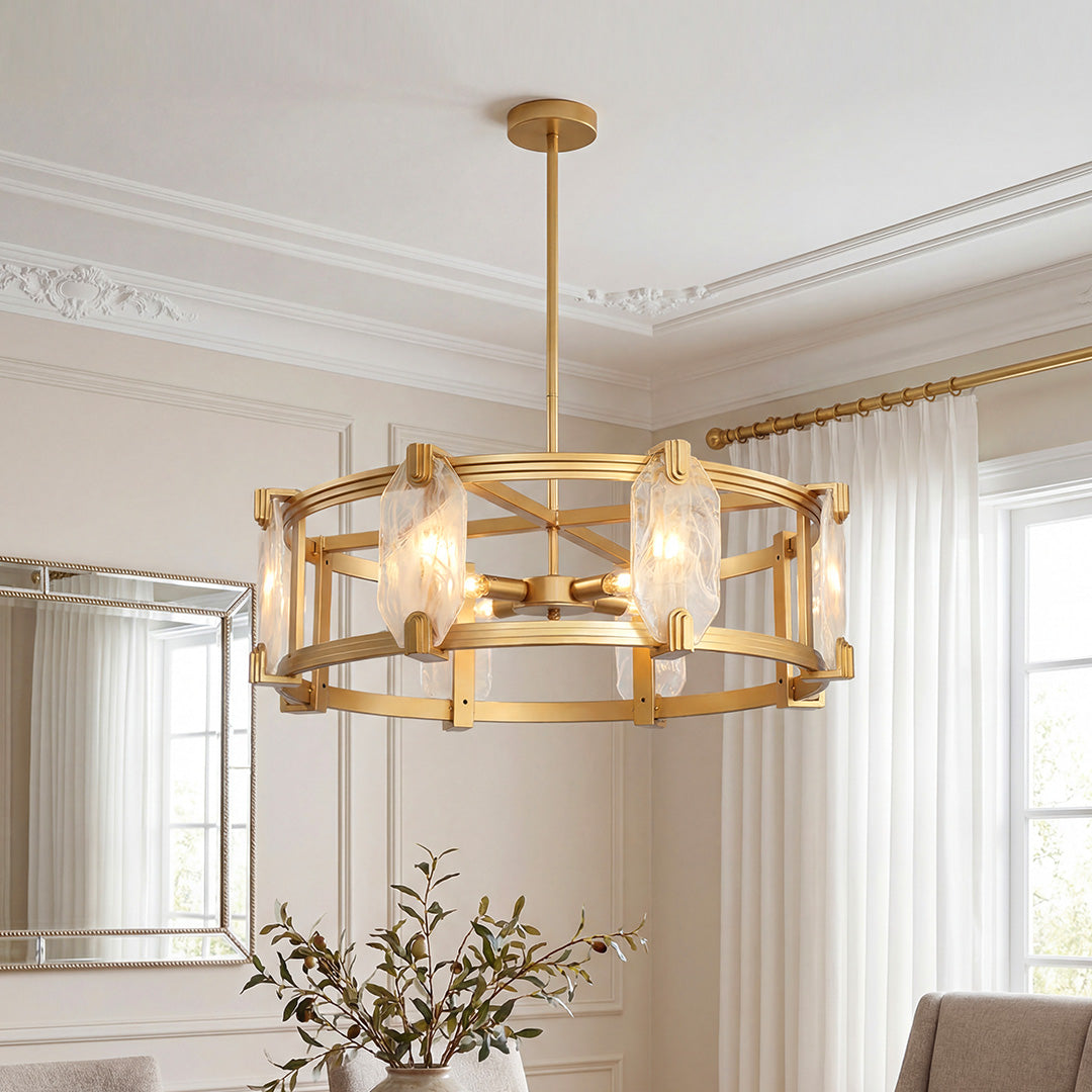 Gold drum chandelier with textured glass panels shown lit