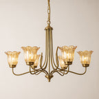 Gold glass chandelier hanging in a sophisticated dining room