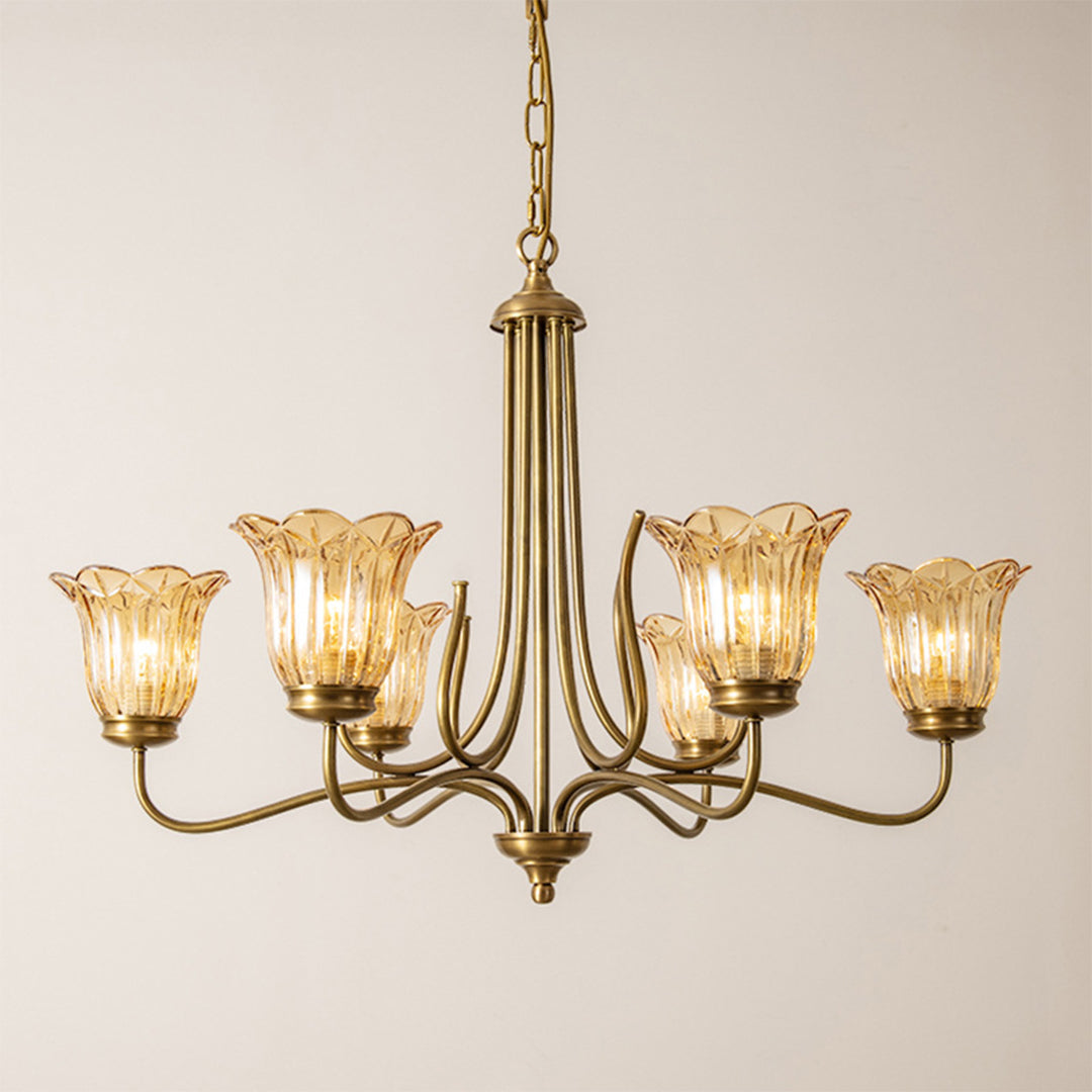 Gold glass chandelier hanging in a sophisticated dining room