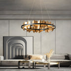 Circular gold leaf chandelier in a modern dining room