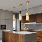 Gold mini crystal pendant lights above a kitchen island