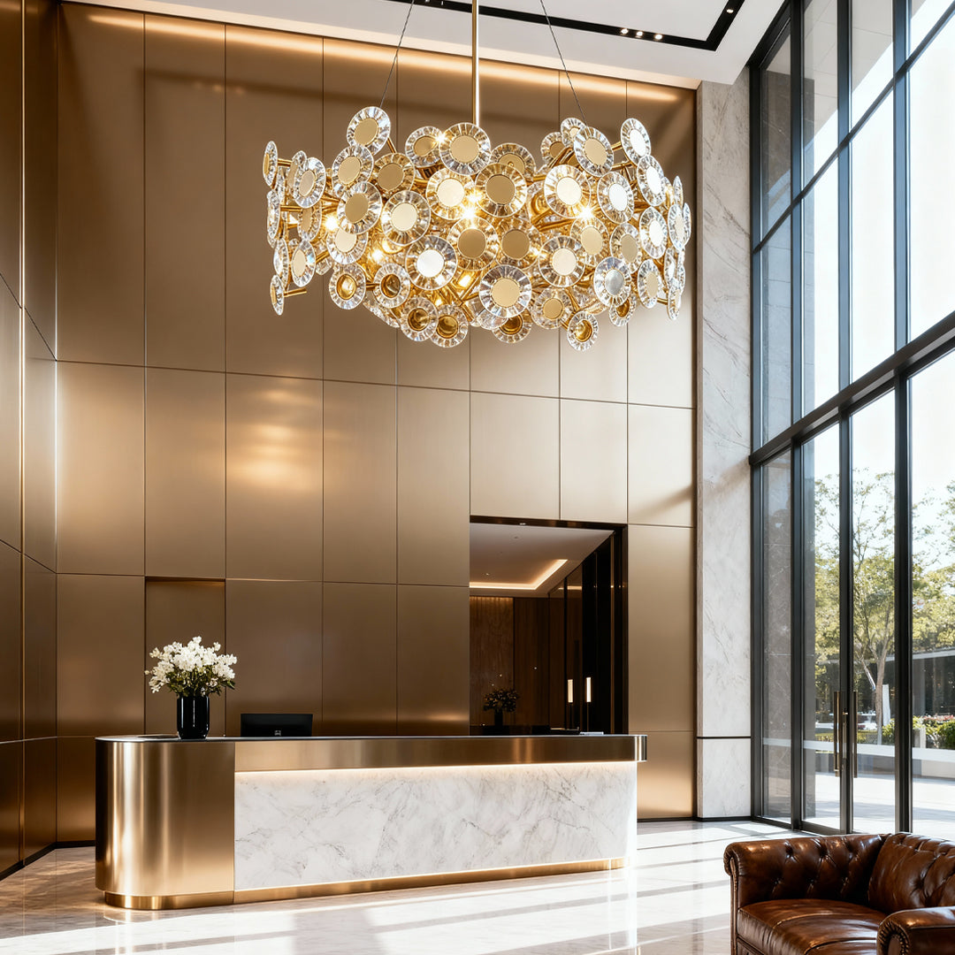 Gold chandelier in an entryway with marble floors