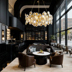 Gold chandelier hanging above circular lounge seating