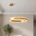 Gold circular chandelier with a textured crystal ring