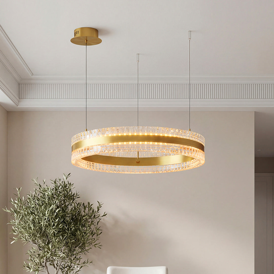 Gold circular chandelier with a textured crystal ring