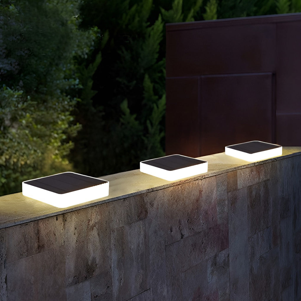 Recessed solar lights casting focused light on a minimalist deck