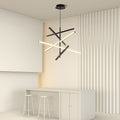 Iron linear chandelier in a beige room with white furniture