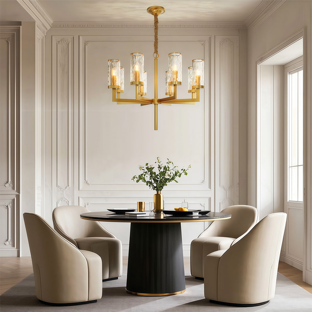 Island chandelier in a contemporary dining room with brass accents