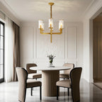 Island chandelier above a round dark wood dining table