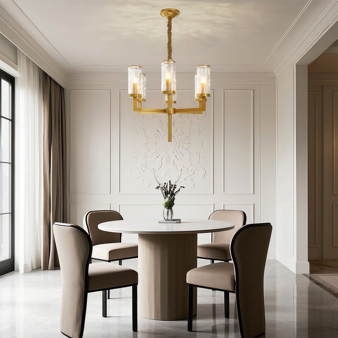 Island chandelier above a round dark wood dining table