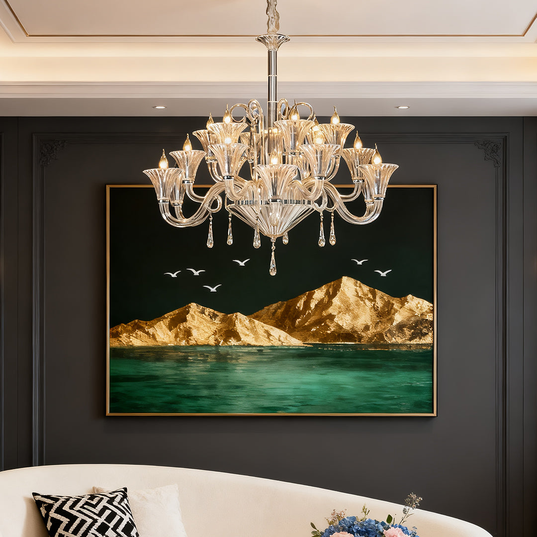 Large art glass chandelier in a dining room with ocean artwork