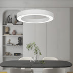 LED ring pendant light hanging in a modern bedroom