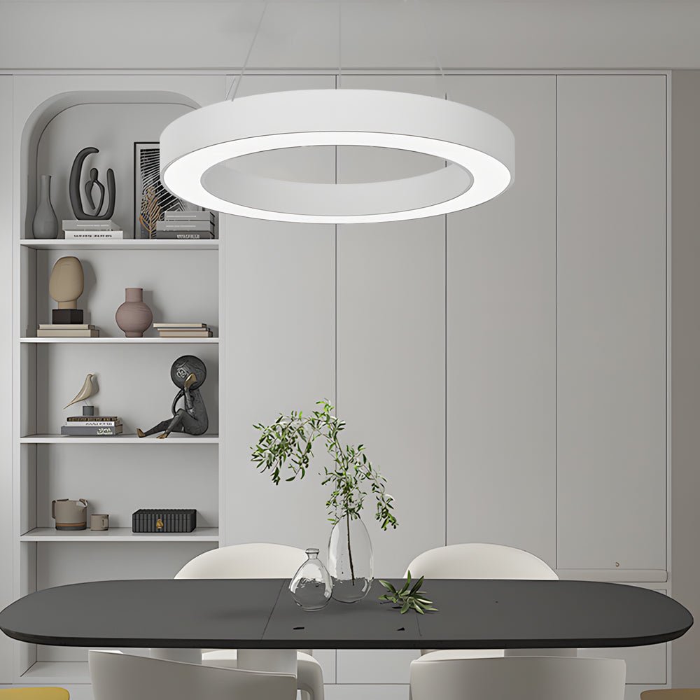 LED ring pendant light hanging in a modern bedroom