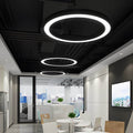 Circular LED ring pendant light in a minimalist home interior