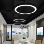 Circular LED ring pendant light in a minimalist home interior