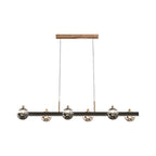 Linear horizontal chandelier with multiple glass spheres