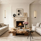 Linear LED wall light above a living room fireplace