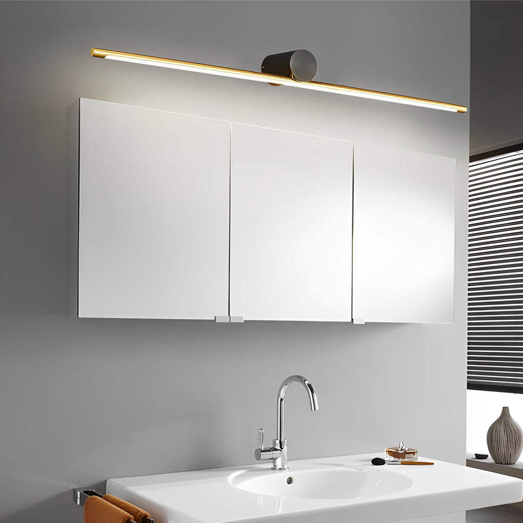 Linear vanity light mounted above an LED mirror cabinet