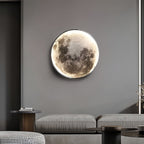 Round full moon wall lamp with lunar surface detail, third product view