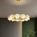 Large glass chandelier hanging in a luxurious bedroom