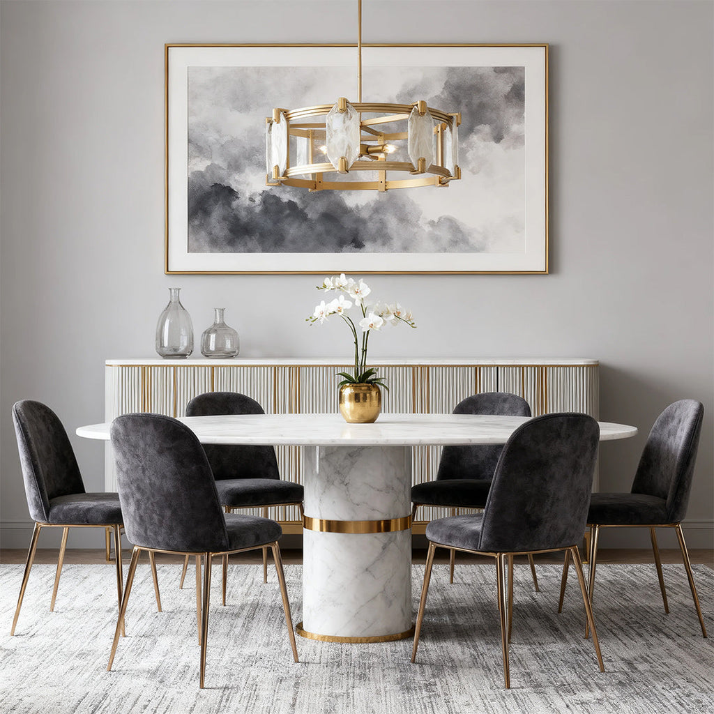 Gold frame chandelier with clear crystal above a marble table