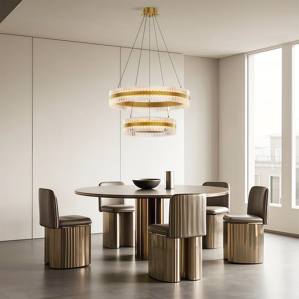 Dual ring circular chandelier hanging above a dining table