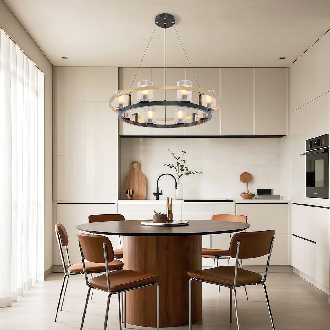 Wagon wheel chandelier over a round table in a minimalist kitchen