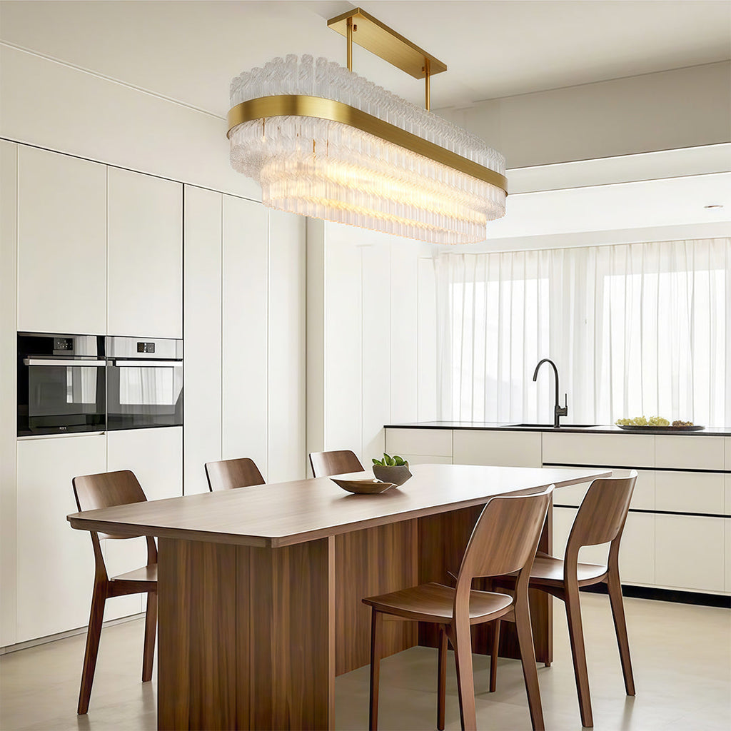 Industrial chandelier in a bright marble kitchen dining space