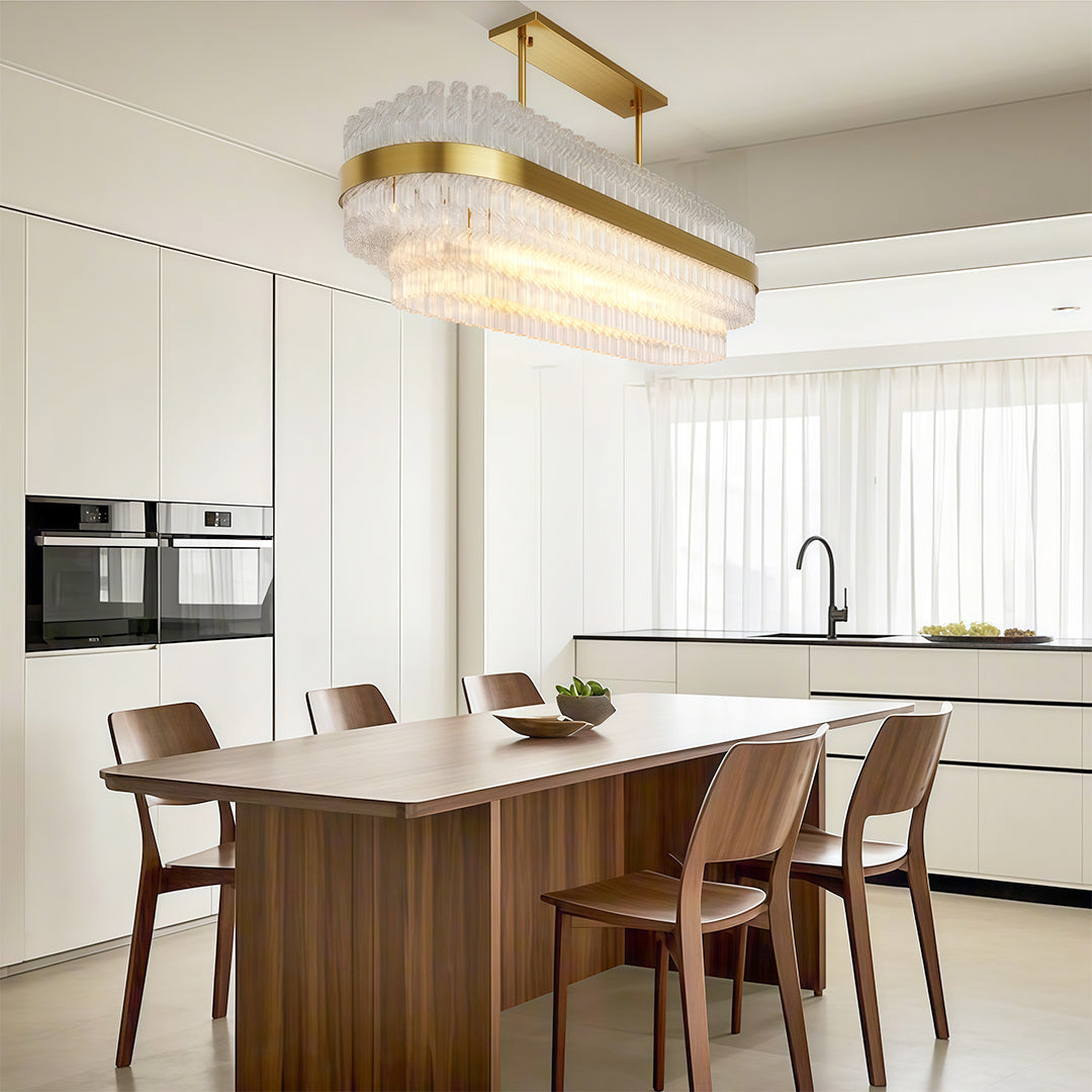 Industrial chandelier in a bright marble kitchen dining space