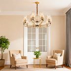 Cluster chandelier in a dining room with a marble fireplace