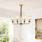 Cluster chandelier in a traditional living room with an arched window
