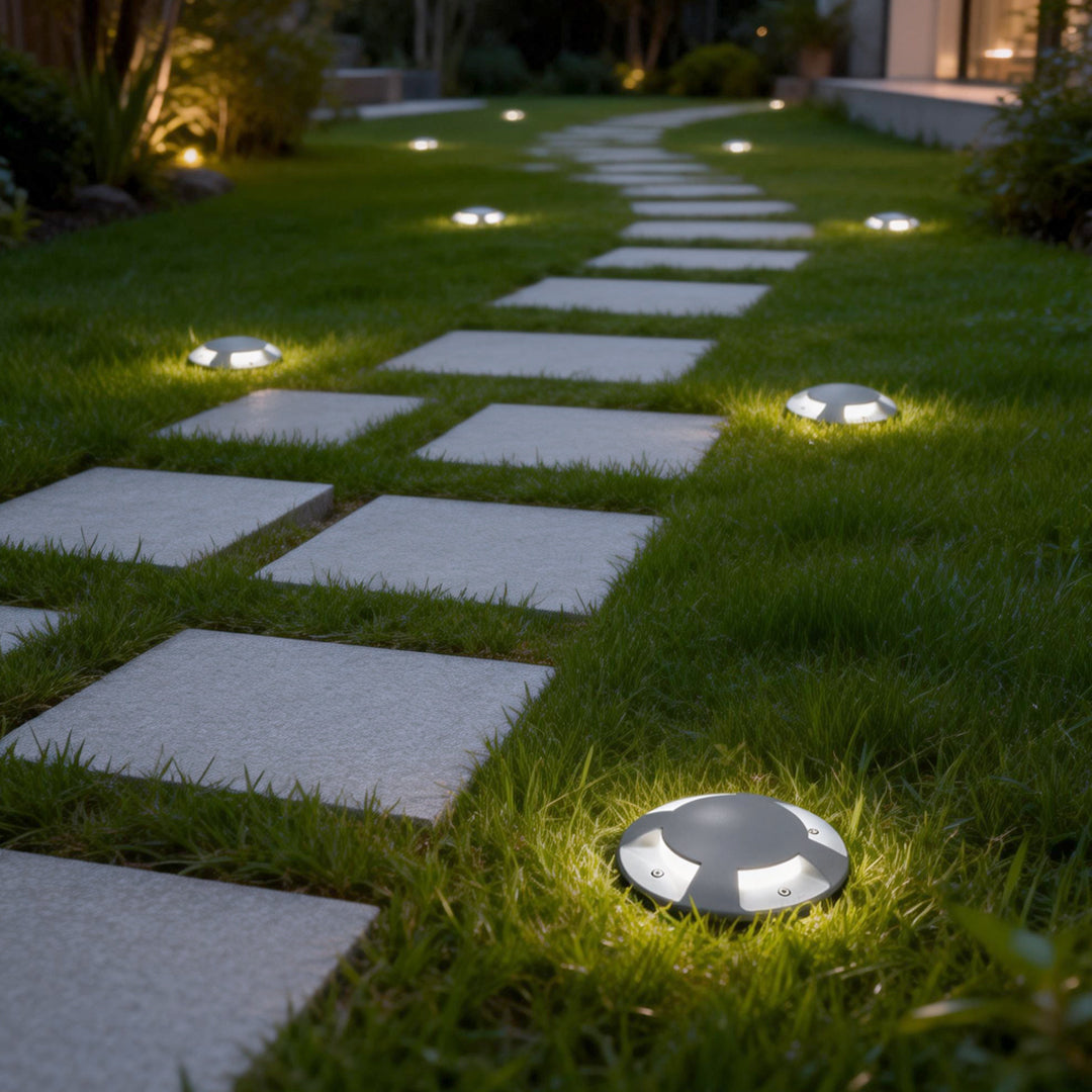 Recessed deck lights giving a warm glow along a garden pathway