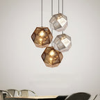 Cluster of geometric metal pendant lights hung together