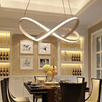 Mobius ring pendant light hanging in a bedroom