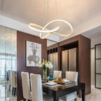 Mobius ring pendant light hanging in a living room