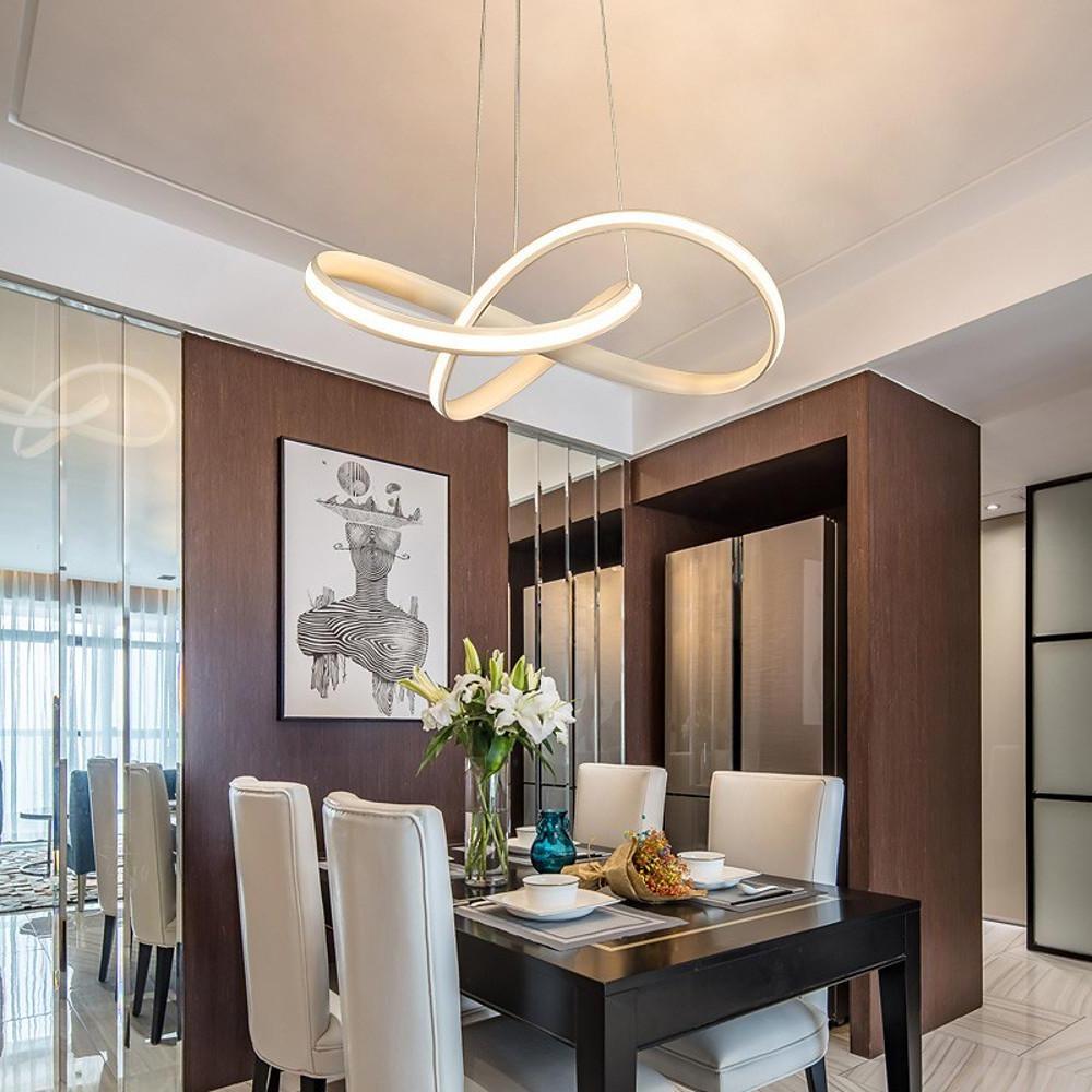 Mobius ring pendant light hanging in a living room