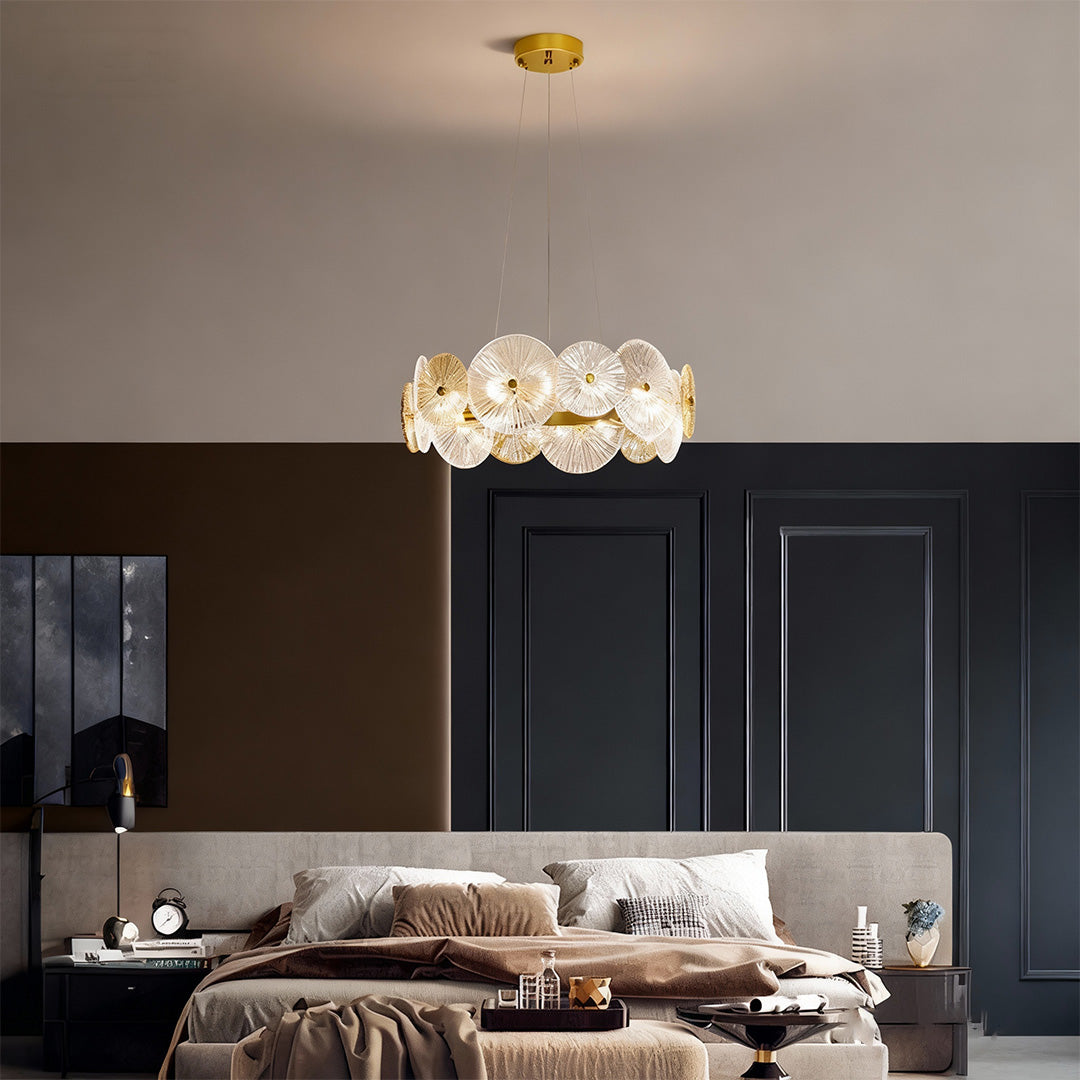 Large glass chandelier hanging in a modern bedroom