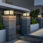 Black grid pillar light on a stone pillar in evening ambiance