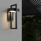 Black rectangular outdoor sconce on a modern white wall