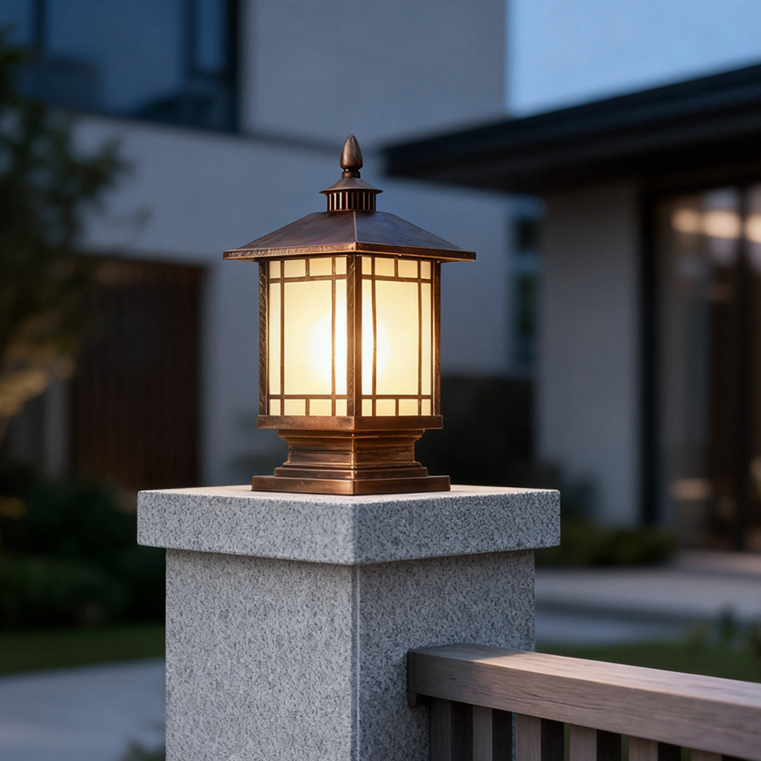 Modern black post lantern on a stone column