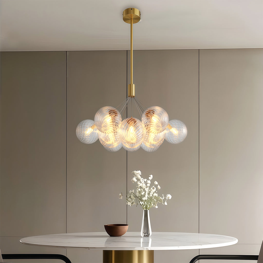Bubble chandelier hanging beside a bedroom side table