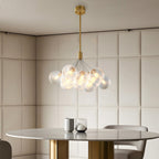 Bubble chandelier hanging in a neutral toned bedroom