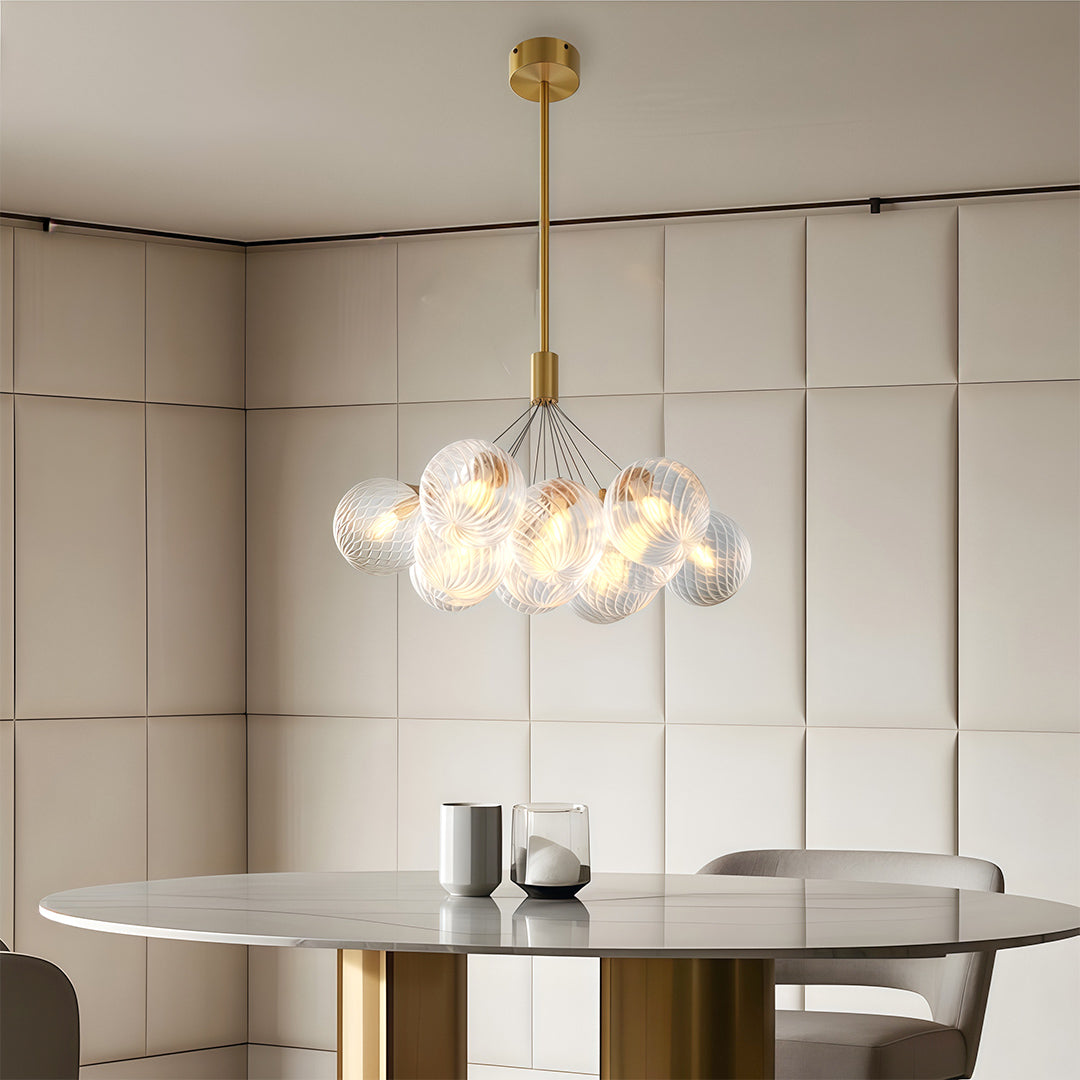 Bubble chandelier hanging in a neutral toned bedroom