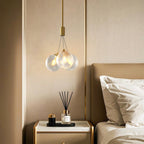 Bubble chandelier hanging in a white bedroom
