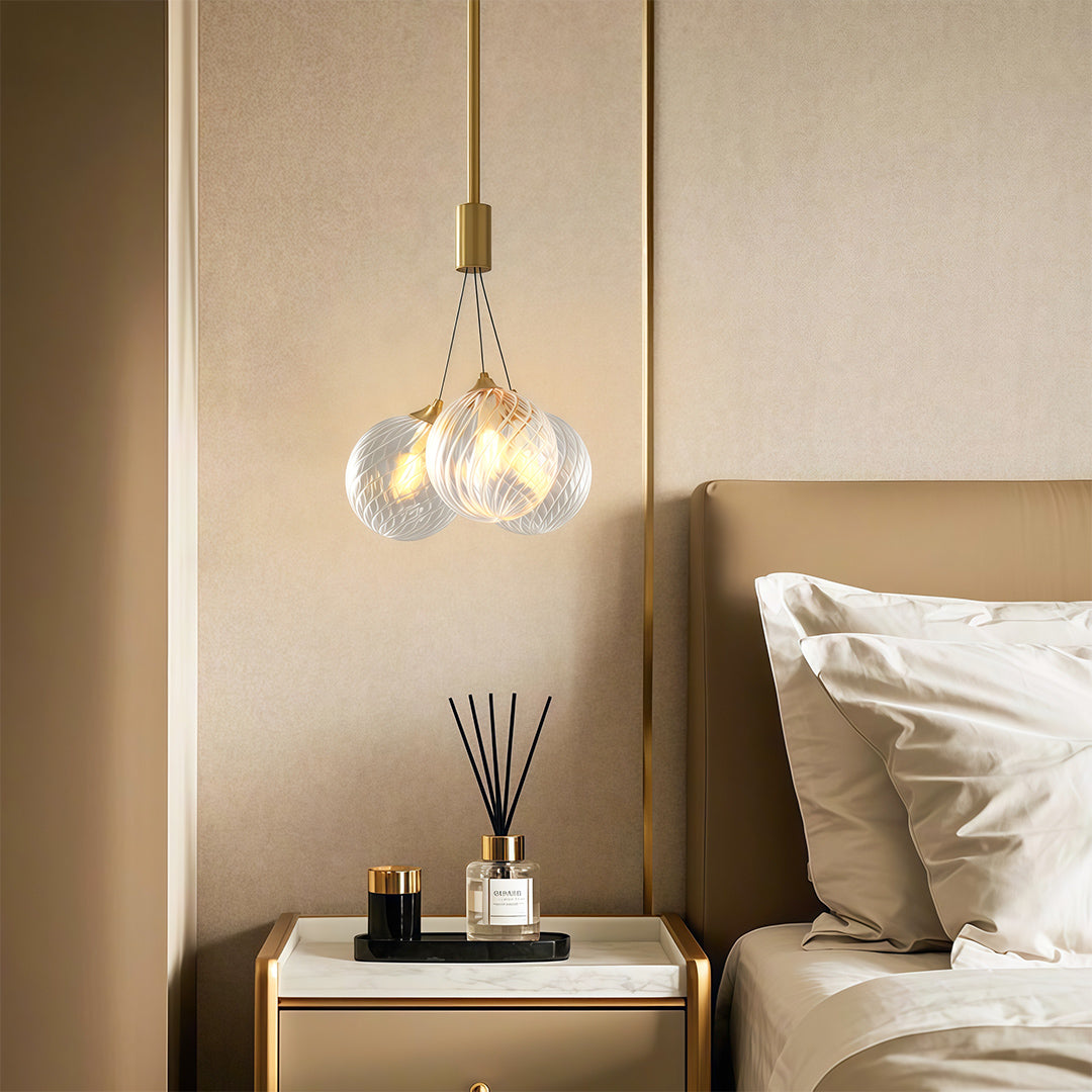 Bubble chandelier hanging in a white bedroom