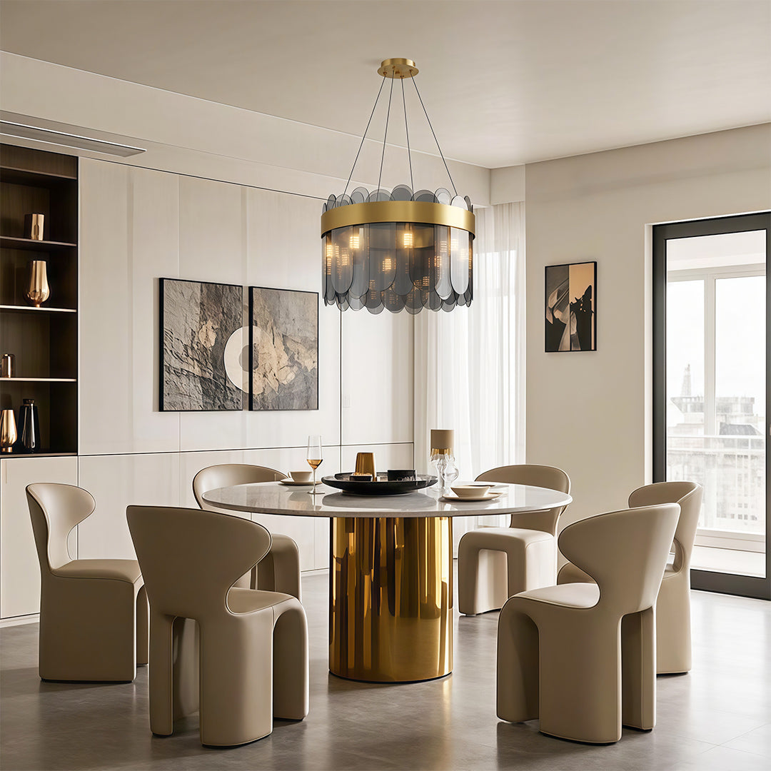 Ring chandelier above an elegant dining table with beige chairs