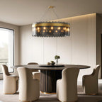Ring chandelier above a round table in a neutral interior
