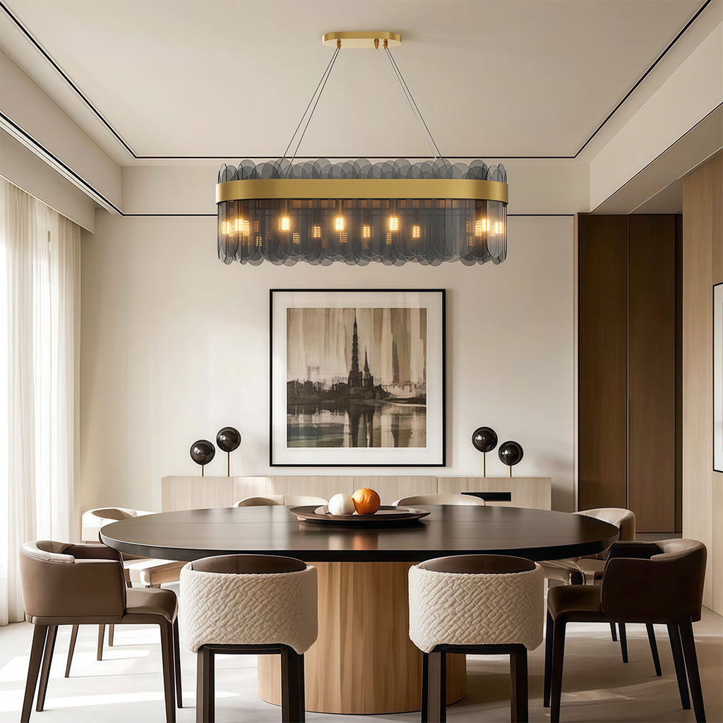 Ring chandelier above sophisticated upholstered dining chairs