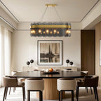 Ring chandelier above sophisticated upholstered dining chairs