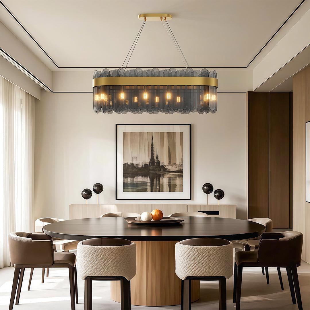 Ring chandelier above sophisticated upholstered dining chairs